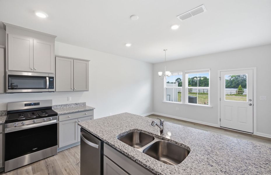 Furnished interior view inside a new home in Saunders Farm, Willow Spring (Image 5).