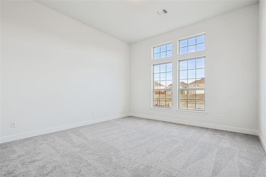 Empty room featuring carpet flooring