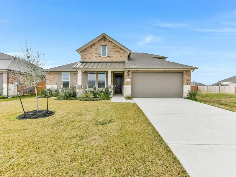 Front exterior of a new home in Lago Mar, Texas City, TX, highlighting curb appeal (Image 2). Front exterior of a new home in Lago Mar, Texas City, TX, highlighting curb appeal (Image 2).