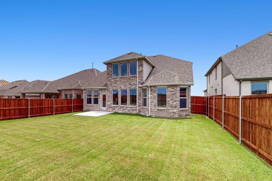 Front exterior of a new home in Lilybrooke at Legacy Hills, Celina, TX, highlighting curb appeal (Image 15).