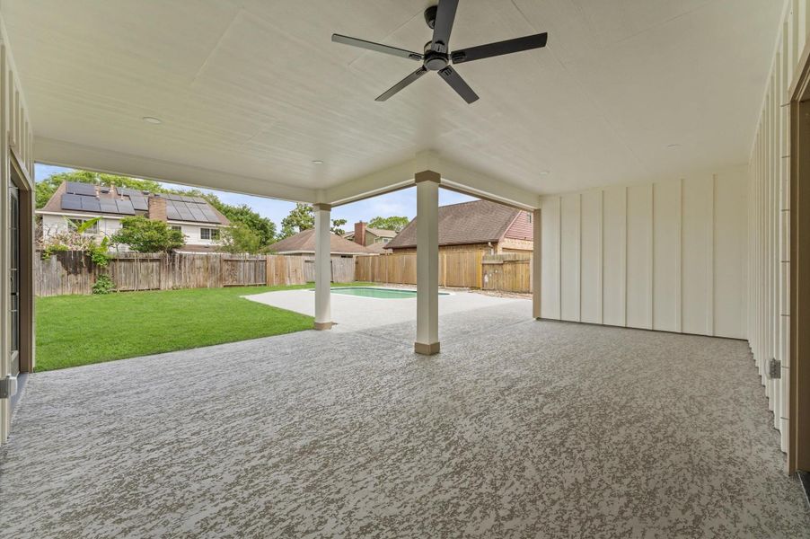 This grand "L" shaped outdoor living space has no limits. There is plenty of space to divide into an outdoor kitchen, dining and separate lounge area.