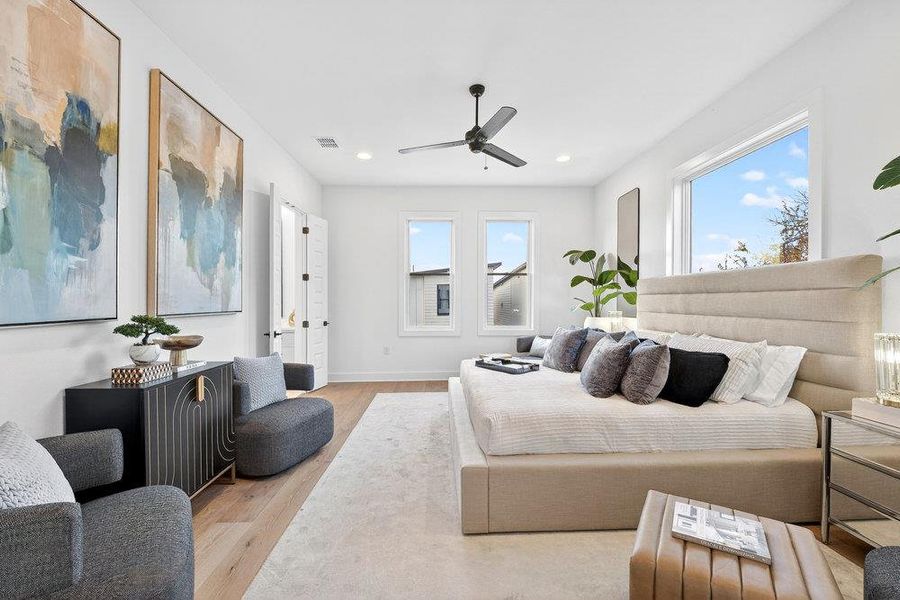 Bedroom featuring light wood-type flooring, a ceiling fan, and recessed lighting