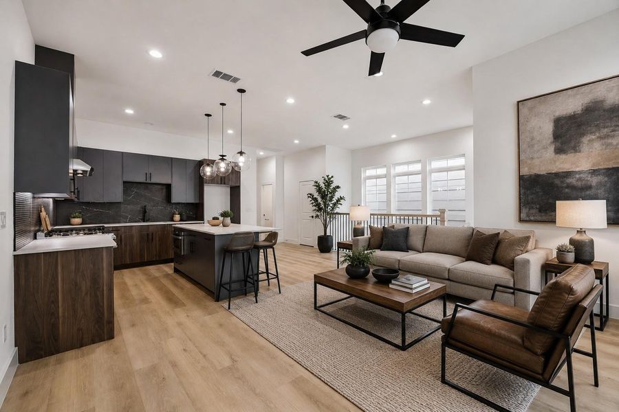 Open-concept view connecting kitchen, dining, and living spaces
