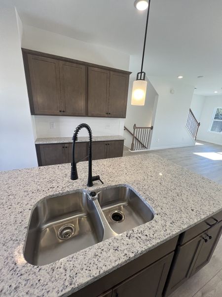 Granite countertops, matte black fixtures