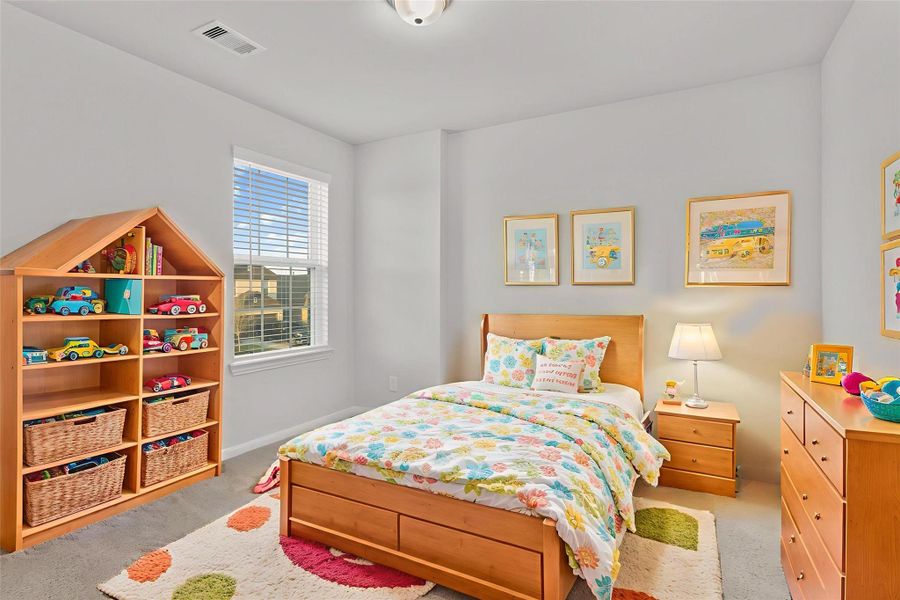 Another virtually staged bedroom displays its versatility as a cheerful child’s room, complete with a bright window and space for play and creativity. The room’s simple design allows for endless decorating possibilities. Another virtually staged bedroom displays its versatility as a cheerful child’s room, complete with a bright window and space for play and creativity. The room’s simple design allows for endless decorating possibilities.