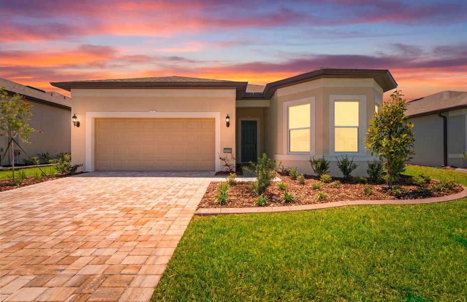 Front exterior of a new home in Del Webb Stone Creek, Ocala, FL, highlighting curb appeal (Image 2). Front exterior of a new home in Del Webb Stone Creek, Ocala, FL, highlighting curb appeal (Image 2).