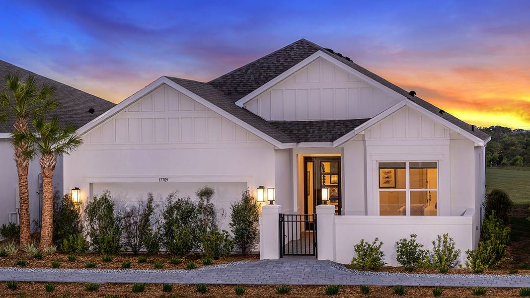 Representative exterior photo of a completed home built from the Lazio II by Taylor Morrison in Esplanade at McKinnon Groves, Winter Garden, FL (Image 2). Representative exterior photo of a completed home built from the Lazio II by Taylor Morrison in Esplanade at McKinnon Groves, Winter Garden, FL (Image 2).