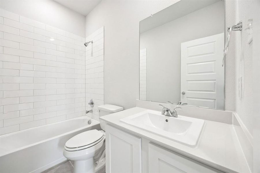 Bathroom in the Emmy II home plan by Trophy Signature Homes - REPRESENTATIVE PHOTO