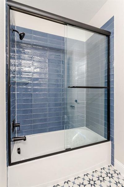 Bathroom featuring enclosed tub / shower combo