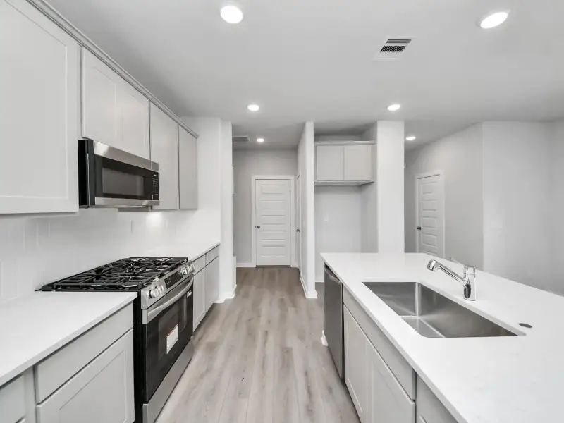 Furnished interior view inside a new home in Windmill Estates, Magnolia (Image 6).