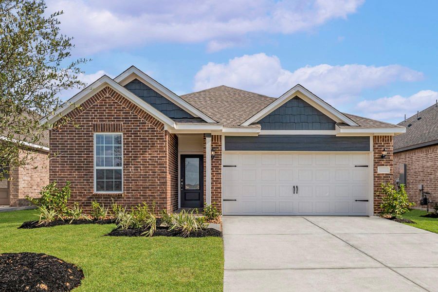 Front exterior of a new home in Emberly, Beasley, TX, highlighting curb appeal (Image 1).