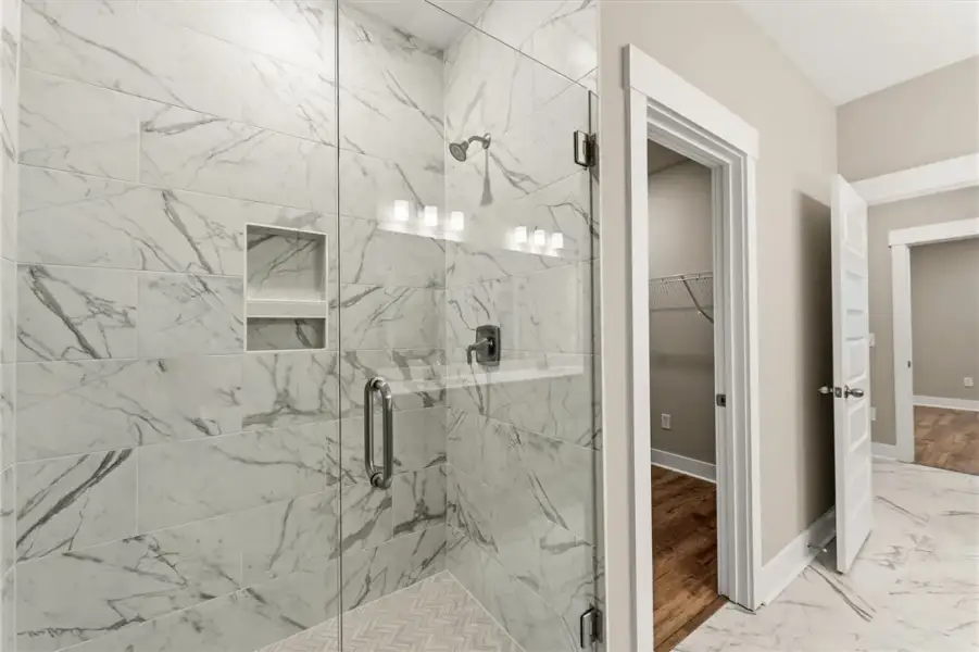 A spacious bathroom showcases a walk-in shower wit A spacious bathroom showcases a walk-in shower wit