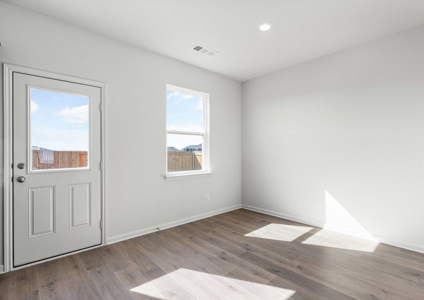 The dining room has a large window that lets in great, natural light.
