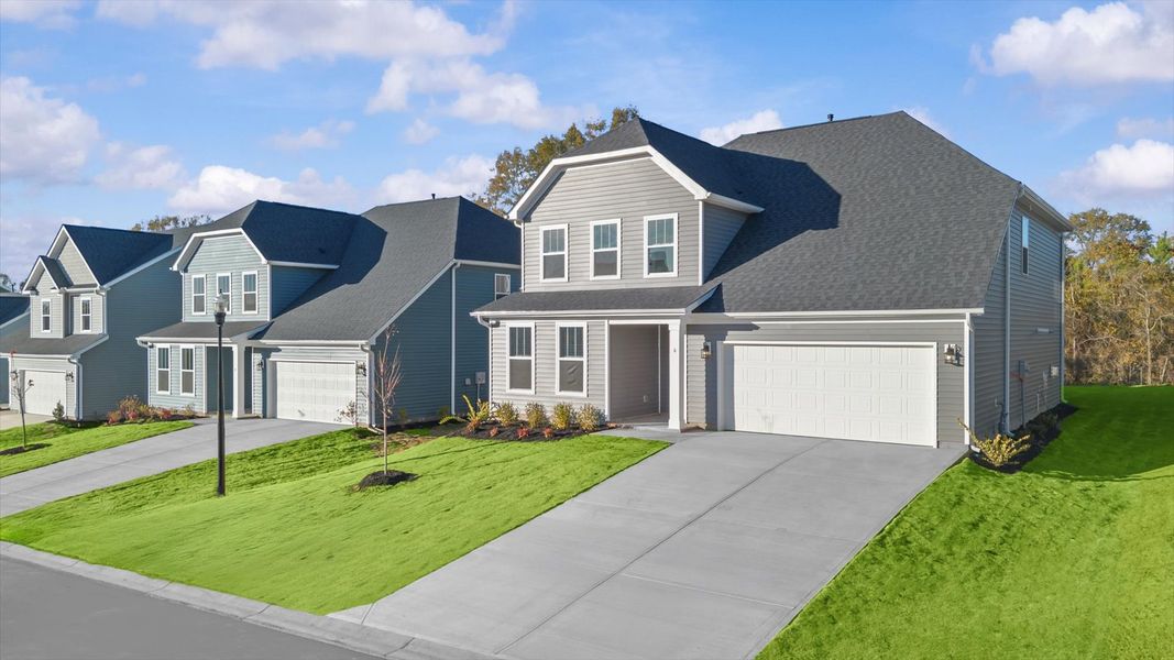 Front exterior of a new home in Woodglen, Piedmont, SC, highlighting curb appeal (Image 2).
