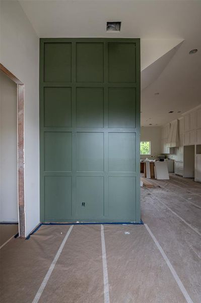 Front foyer with trending grid accent wall as you make your way up the front staircase.