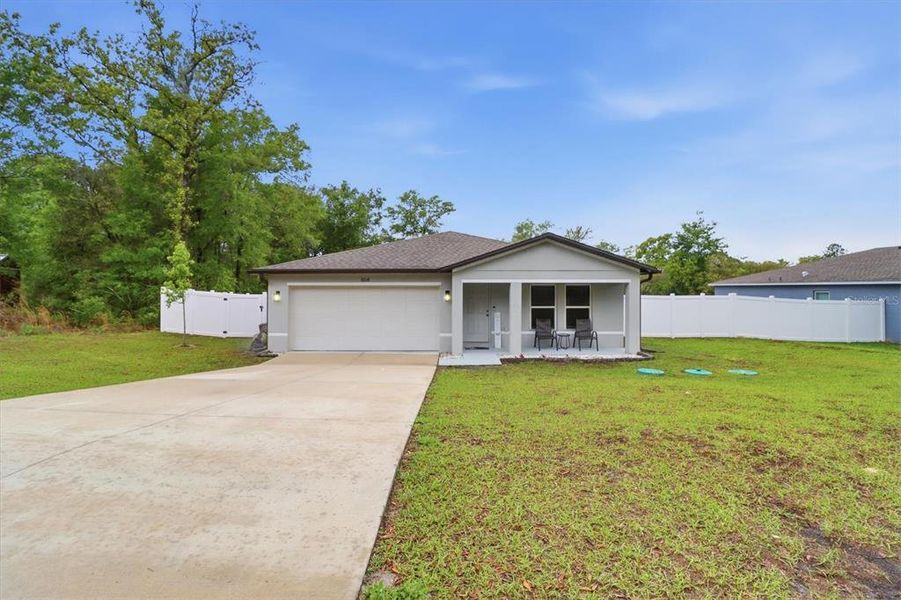 Front exterior of a new home in , Citrus Springs, FL, highlighting curb appeal (Image 1). Front exterior of a new home in , Citrus Springs, FL, highlighting curb appeal (Image 1).