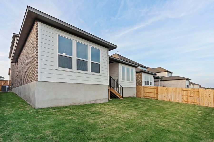 Exterior details and patio area of a home in Park Collection at Lariat, Liberty Hill (Image 29). Exterior details and patio area of a home in Park Collection at Lariat, Liberty Hill (Image 29).