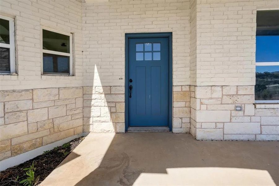Property entrance with brick siding