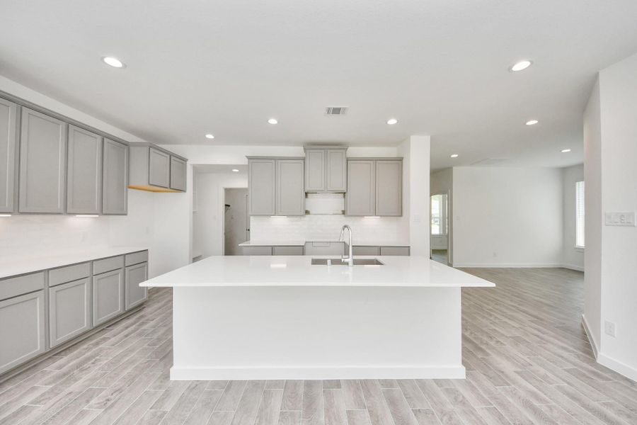 The extended counter area adds both practicality and style, making meal preparation a breeze. Every detail is thoughtfully designed to enhance the kitchen's functionality and aesthetic appeal. The extended counter area adds both practicality and style, making meal preparation a breeze. Every detail is thoughtfully designed to enhance the kitchen's functionality and aesthetic appeal.