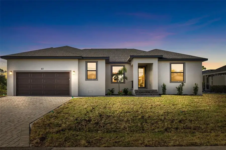 Front exterior of a new home in , Rotonda West, FL, highlighting curb appeal (Image 24).