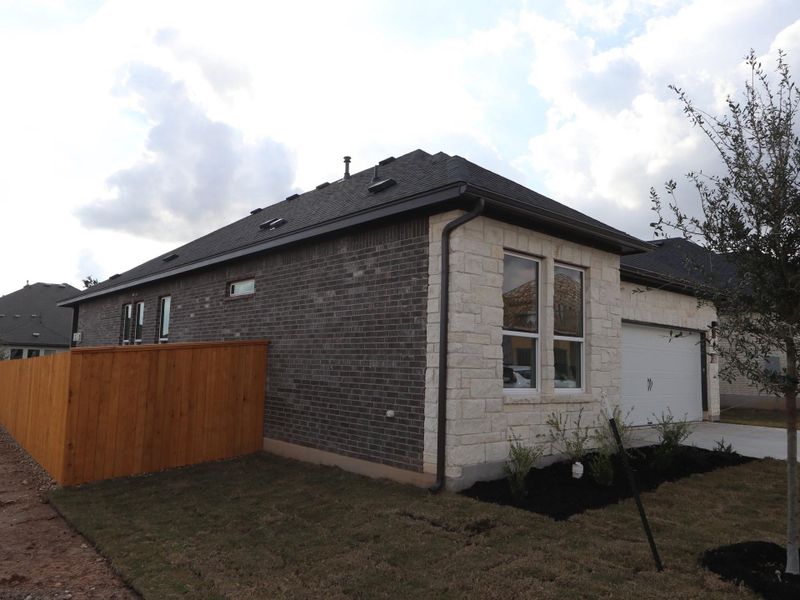 Exterior details and patio area of a home in Heritage, Dripping Springs (Image 4).