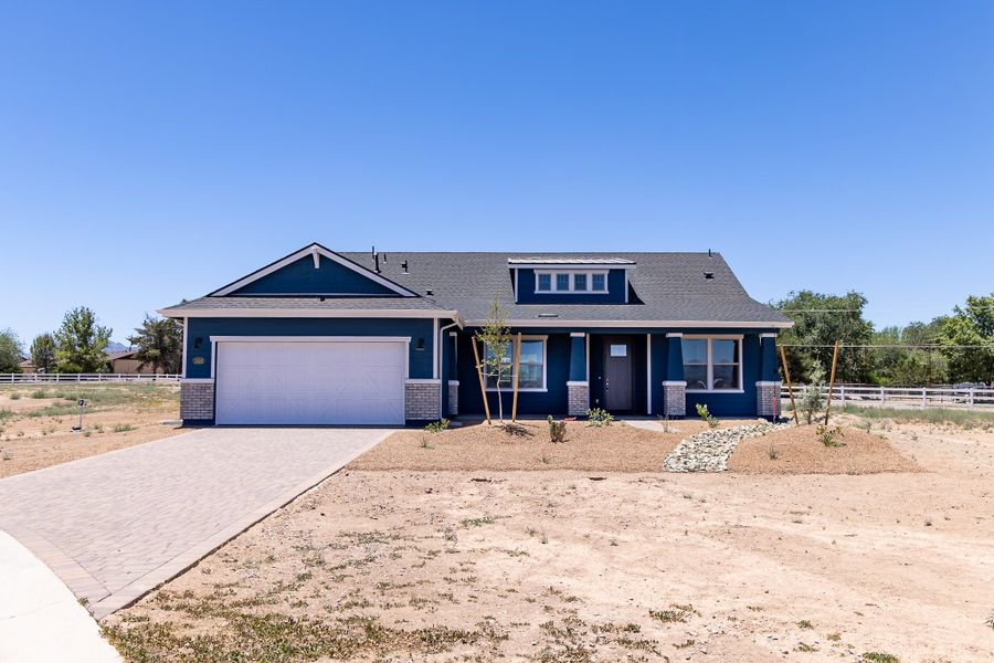 Front exterior of a new home in Heritage Pointe, Chino Valley, AZ, highlighting curb appeal (Image 2). Front exterior of a new home in Heritage Pointe, Chino Valley, AZ, highlighting curb appeal (Image 2).