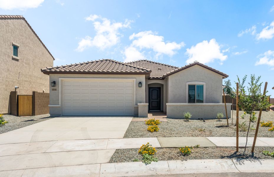 Front exterior of a new home in El Rancho Santa Rosa, Maricopa, AZ, highlighting curb appeal (Image 1). Front exterior of a new home in El Rancho Santa Rosa, Maricopa, AZ, highlighting curb appeal (Image 1).