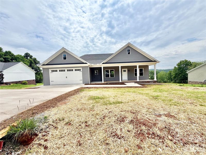 Front exterior of a new home in , Taylorsville, NC, highlighting curb appeal (Image 15).
