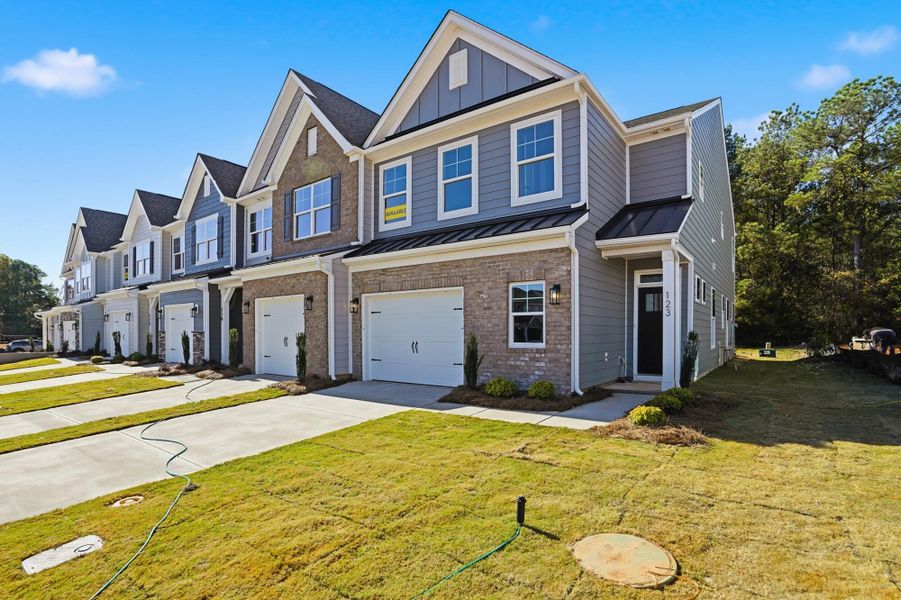 Front exterior of a new home in Blythe Mill Townhomes, Waxhaw, NC, highlighting curb appeal (Image 22). Front exterior of a new home in Blythe Mill Townhomes, Waxhaw, NC, highlighting curb appeal (Image 22).