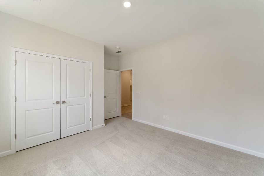 Spacious, unfurnished interior of a new home in Landing at Pine Lake, Anderson (Image 21).