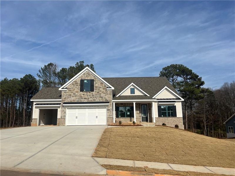 Front exterior of a new home in , Loganville, GA, highlighting curb appeal (Image 18).