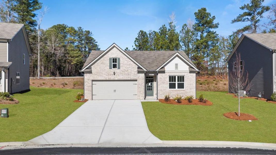 Front exterior of a new home in Northwoods at Mirror Lake, Villa Rica, GA, highlighting curb appeal (Image 19).