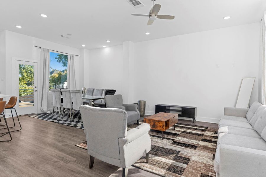 Modern open floor plan combining dining and living areas with effortless style. Modern open floor plan combining dining and living areas with effortless style.