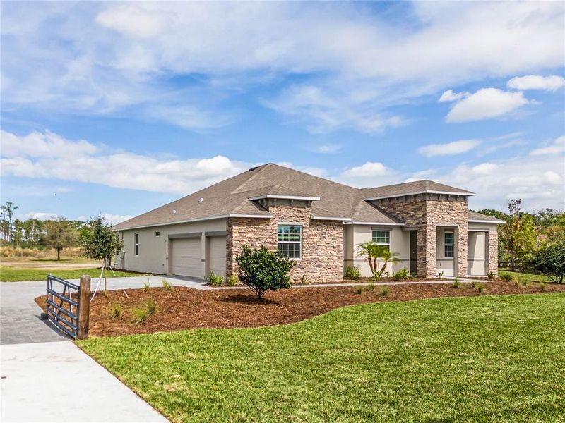 Front exterior of a new home in , Orlando, FL, highlighting curb appeal (Image 1). Front exterior of a new home in , Orlando, FL, highlighting curb appeal (Image 1).