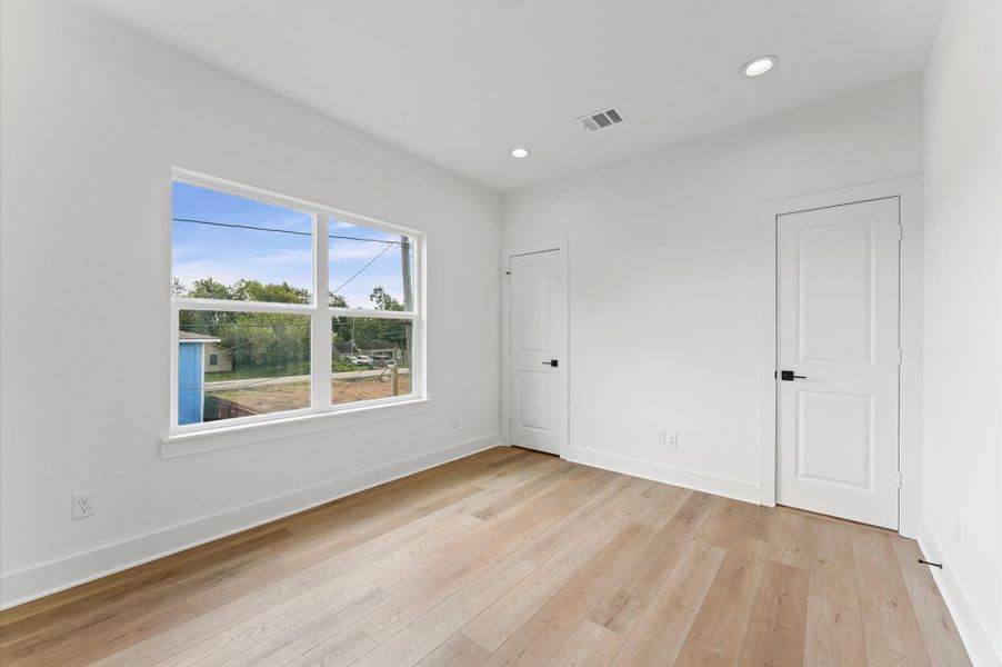 Upstairs bedroom with plenty of natural light.