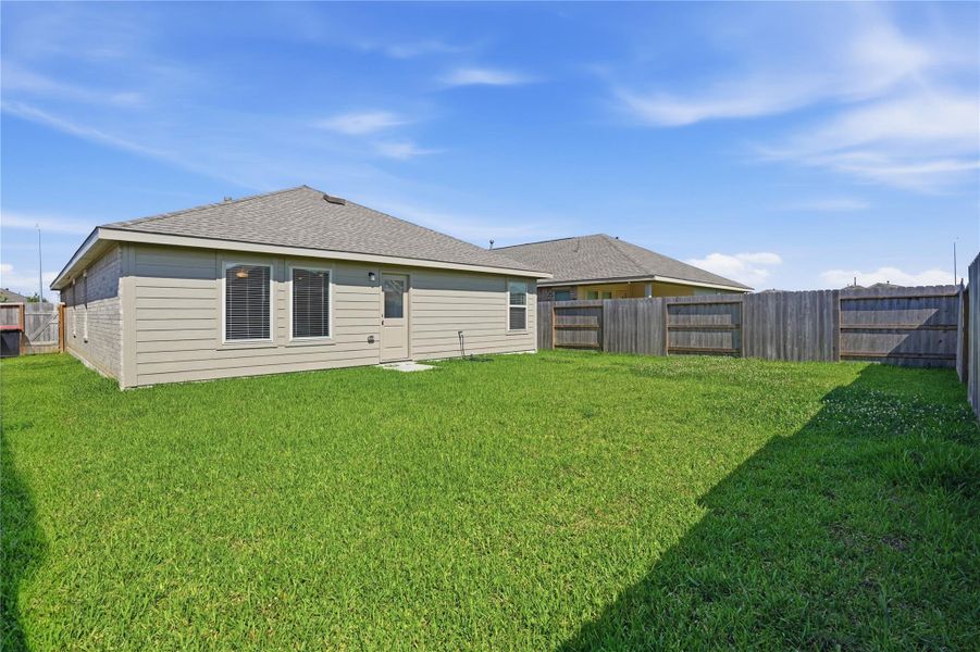 Exterior details and patio area of a home in Sterling Point at Baytown Crossings: Watermill Collection, Baytown (Image 3).