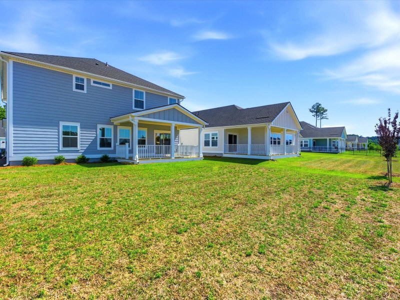 Exterior details and patio area of a home in The Coves at Lakes of Cane Bay, Summerville (Image 19). Exterior details and patio area of a home in The Coves at Lakes of Cane Bay, Summerville (Image 19).