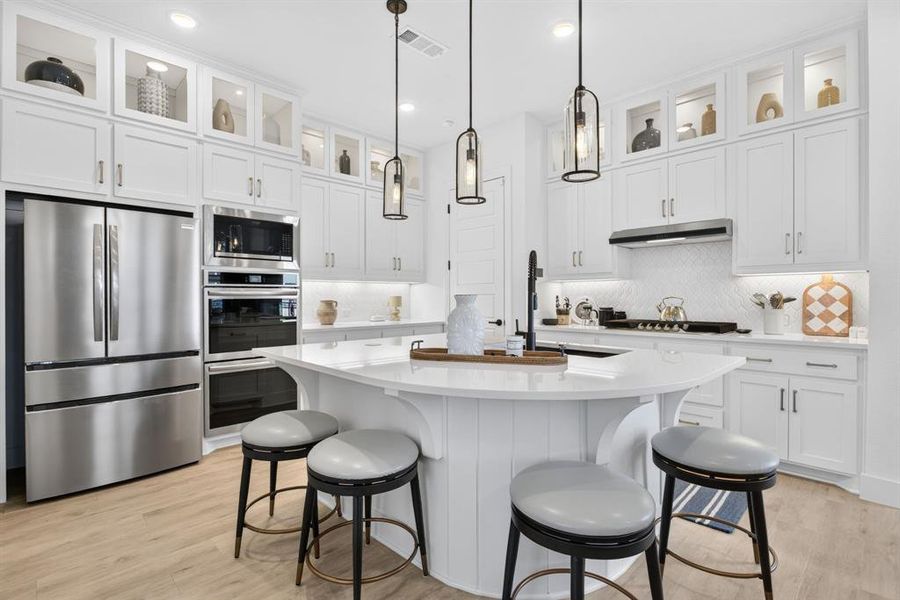 Builder upgraded the upper cabinets with glass fronts and puck lighting - what a difference it makes! Builder upgraded the upper cabinets with glass fronts and puck lighting - what a difference it makes!
