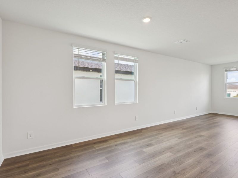 Spacious, unfurnished interior of a new home in The Reserve at Hammock Oaks - Classic Series, Lady Lake (Image 7).