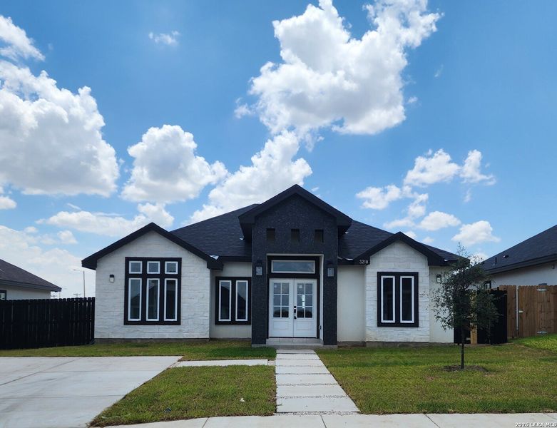 Front exterior of a new home in , Eagle Pass, TX, highlighting curb appeal (Image 2). Front exterior of a new home in , Eagle Pass, TX, highlighting curb appeal (Image 2).
