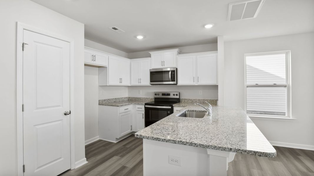 Furnished interior view inside a new home in Tanglewood Townes, Greenville (Image 6).