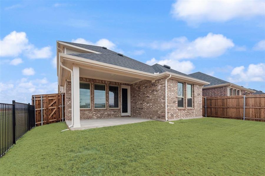 Exterior details and patio area of a home in Walden Pond, Forney (Image 20).