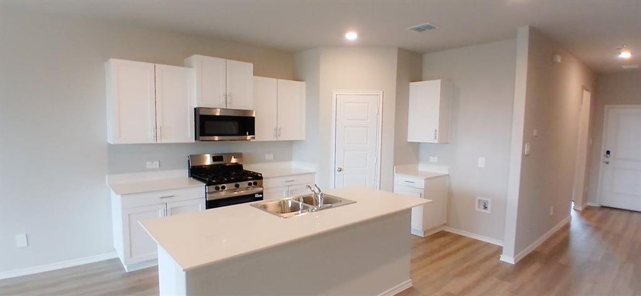 Kitchen - All Home and community information, including pricing, included features, terms, availability and amenities, are subject to change at any time without notice or obligation. All Drawings, pictures, photographs, video, square footages, floor plans, elevations, features, colors and sizes are approximate for illustration purposes only and will vary from the homes as built.