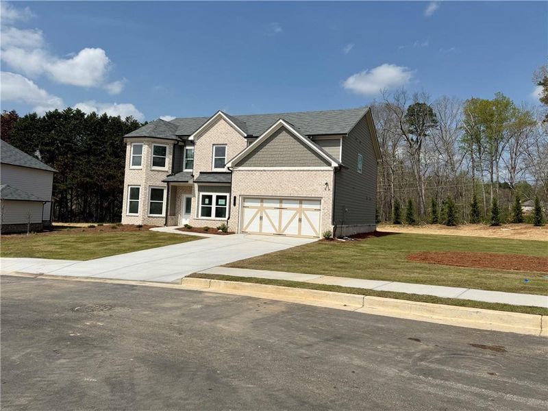 Front exterior of a new home in , Hoschton, GA, highlighting curb appeal (Image 7). Front exterior of a new home in , Hoschton, GA, highlighting curb appeal (Image 7).