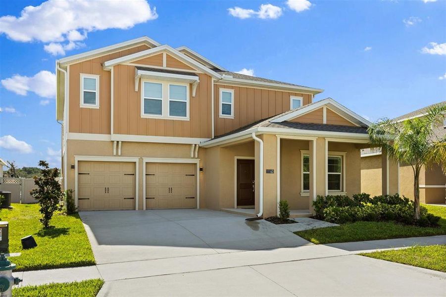 Front exterior of a new home in , Winter Garden, FL, highlighting curb appeal (Image 2).