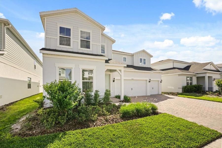 Front exterior of a new home in , Orlando, FL, highlighting curb appeal (Image 25).