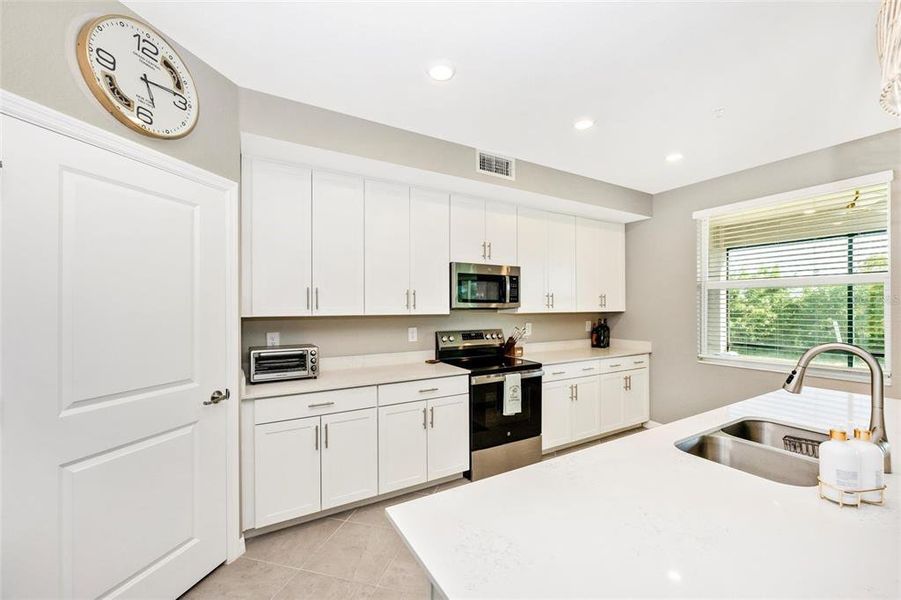 Furnished interior view inside a new home in Wellen Park Golf & Country Club, Venice (Image 37).