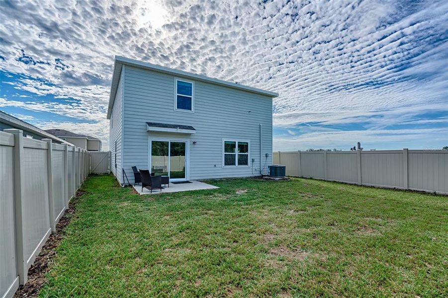 Front exterior of a new home in Avalon Woods, Newberry, FL, highlighting curb appeal (Image 26). Front exterior of a new home in Avalon Woods, Newberry, FL, highlighting curb appeal (Image 26).