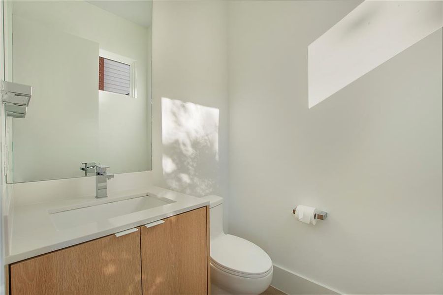 Bathroom featuring toilet and vanity