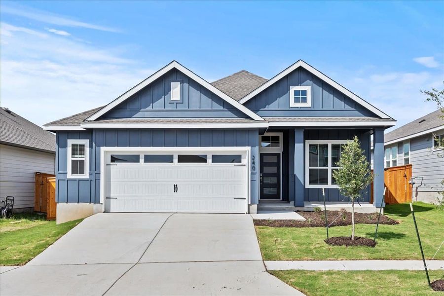 Front exterior of a new home in Trace, San Marcos, TX, highlighting curb appeal (Image 2).